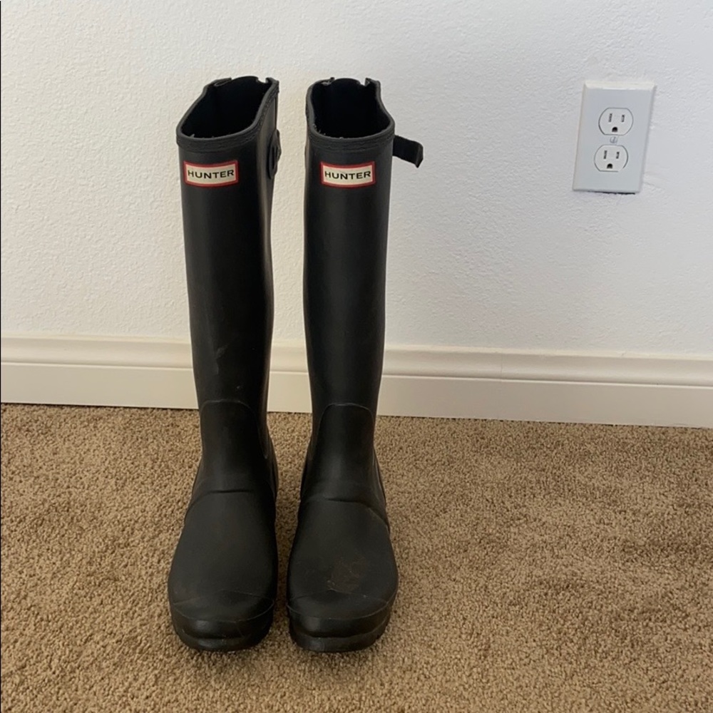 Black hunter boots with expandable buckle on calf